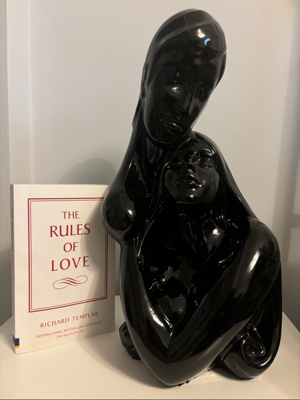 Sleek Black Contemporary Embrace Sculpture